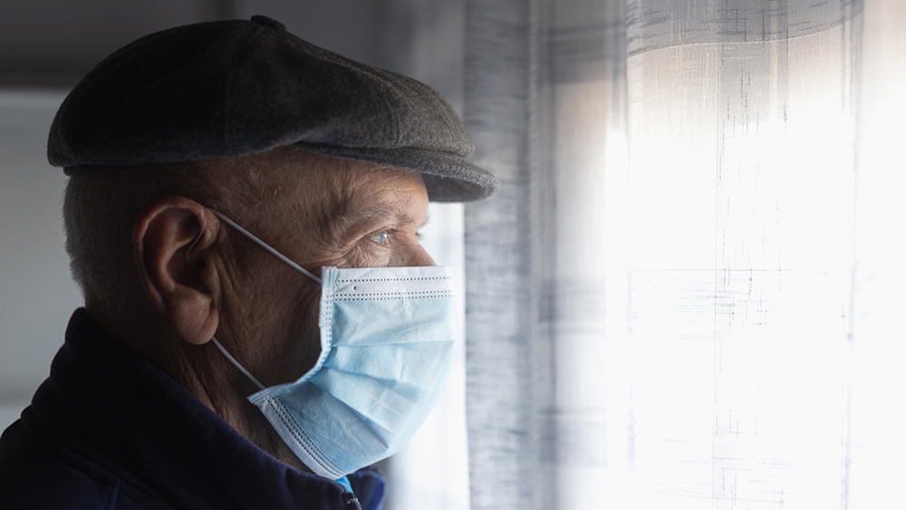 COVID-19 Portrait of an old man with antivirus mask looking at t